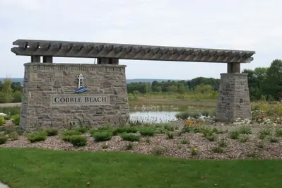 Coursed limestone gate post at the Cobble Beach Golf Links entrance