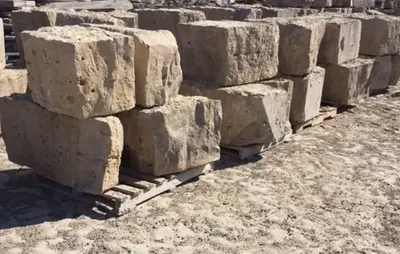 Armour stone block staged in the yard