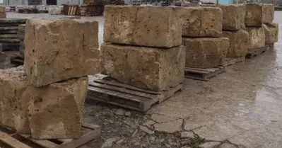 Armour stone block staged in the yard