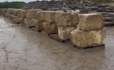 Armour stone block staged in the yard