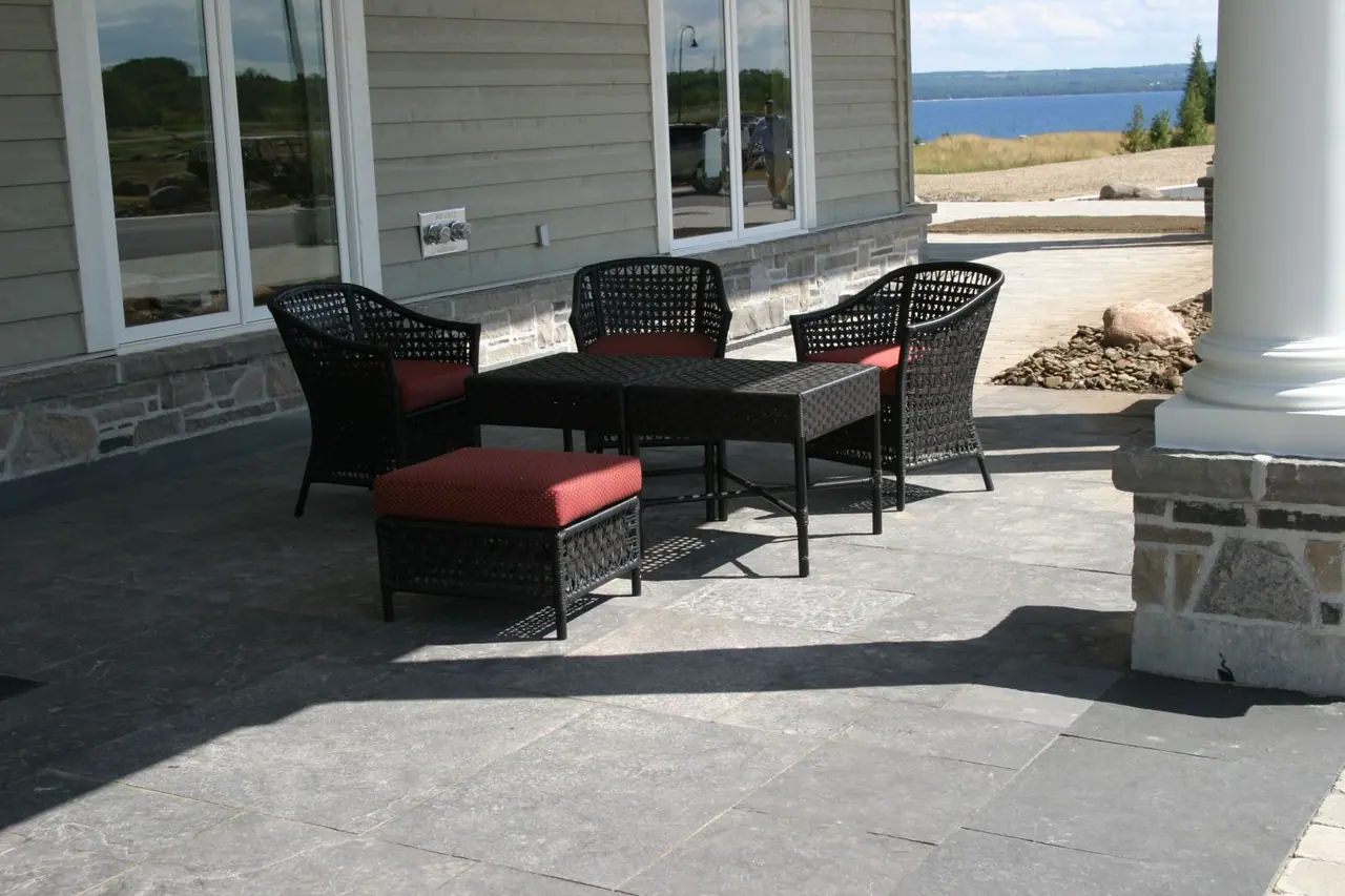 Square cut limestone pavers on a lakeside patio