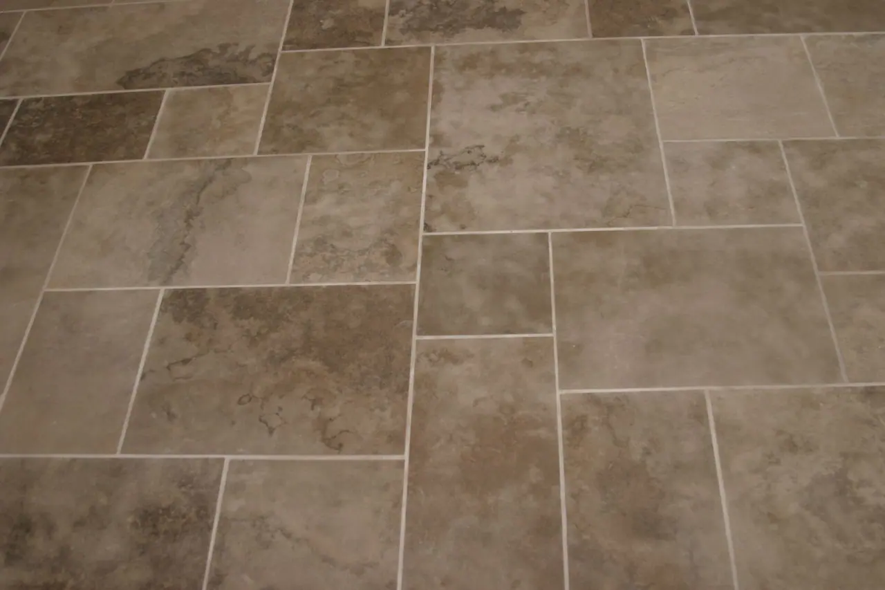 Sandblasted Algonquin limestone floor tiles in a modular pattern