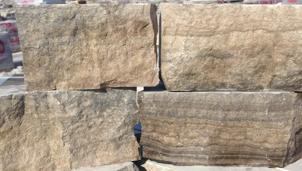 Split face limestone blocks stacked at the quarry